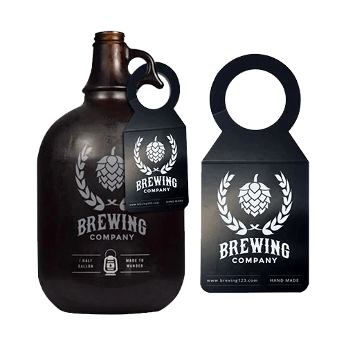 Branded growler tag wrapped around the handle of a glass beer growler, with personalized engraving of a brewery logo
